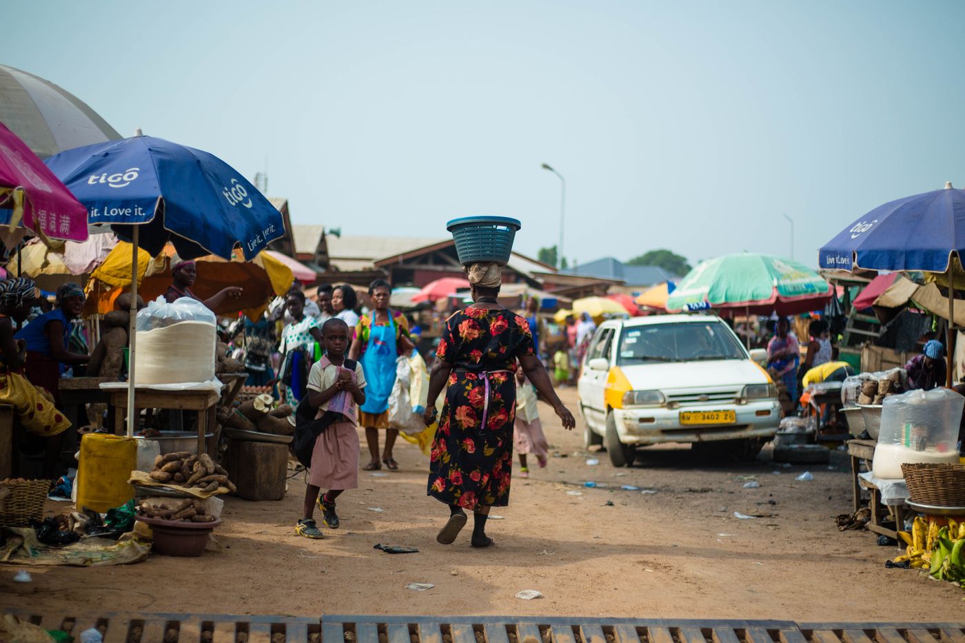 People shopping and trading at an open-air market in Accra